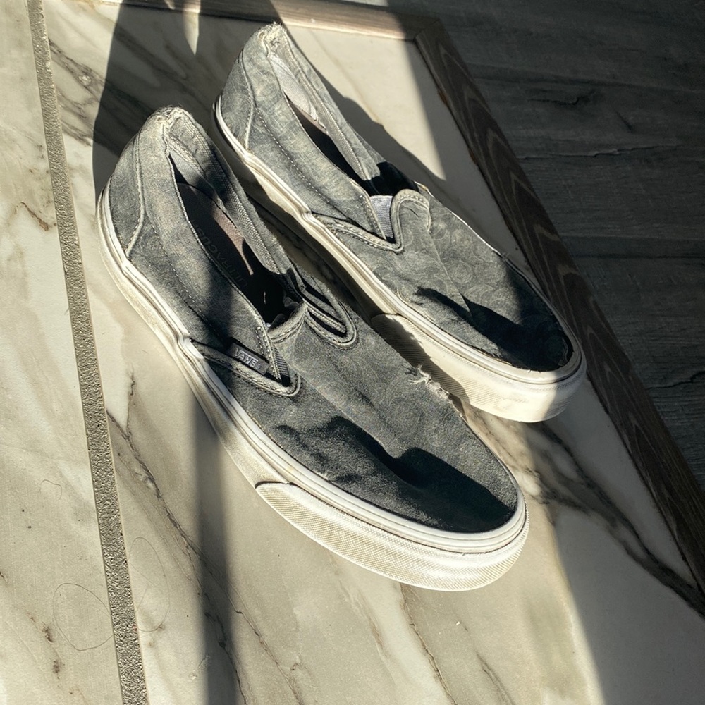 Gray vans that are worn
